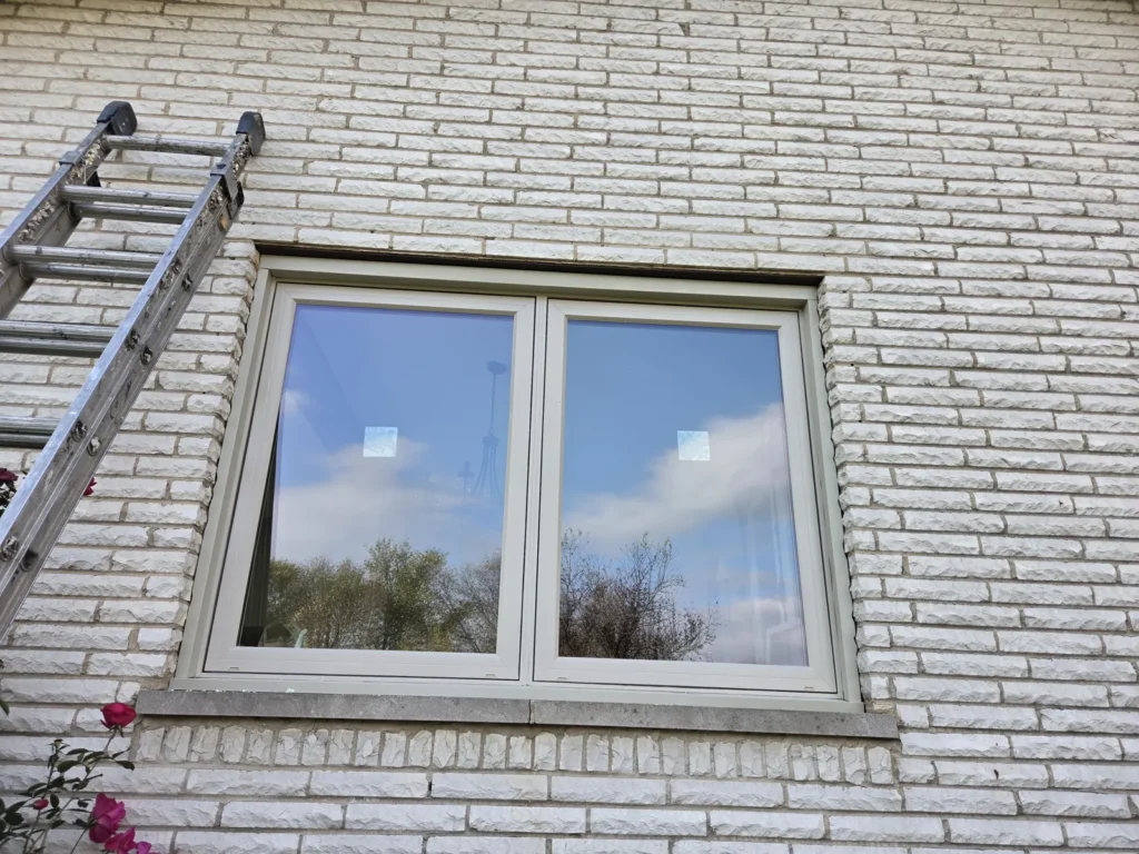 Completed white-framed picture window and exterior trim in Homer Glen