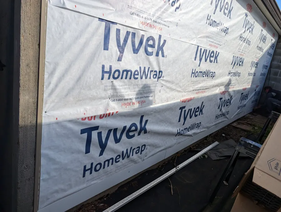 Exterior wall wrap during siding preparation at an Addison home