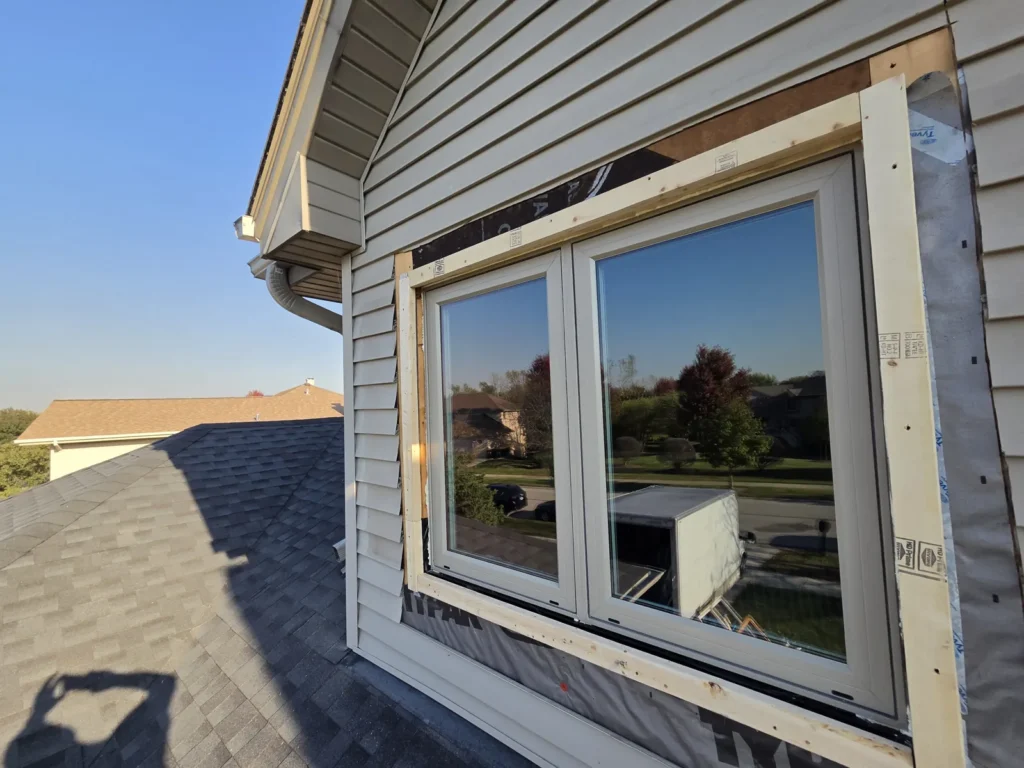 Paired window units during exterior preparation on Campbell Street in Des Plaines