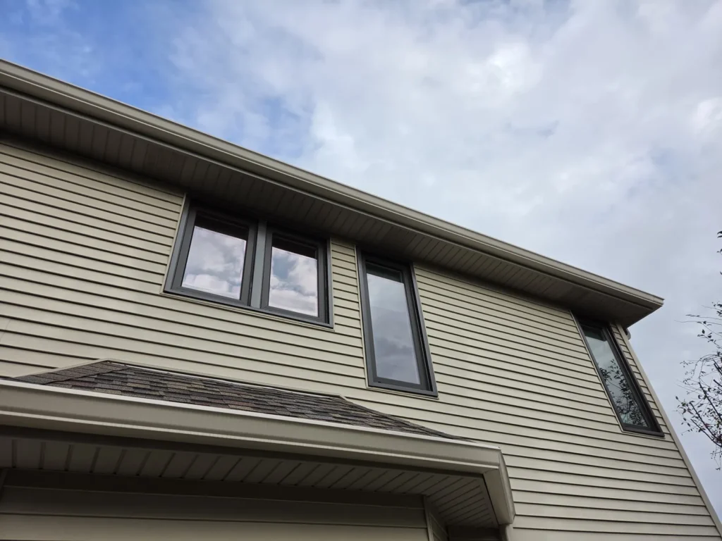 Dark-framed upper-story windows along the Main Street home in Homer Glen